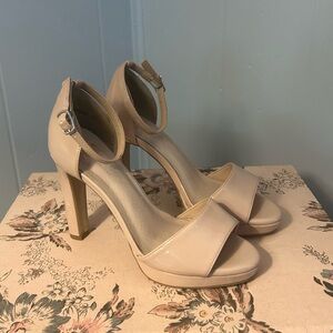 Nude patent high heels